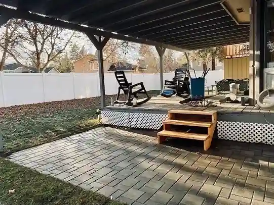 Paver patio laid beneath a covered deck