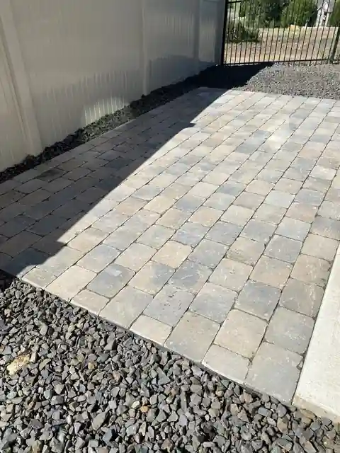 Paver walk with a strip of gravel alongside it